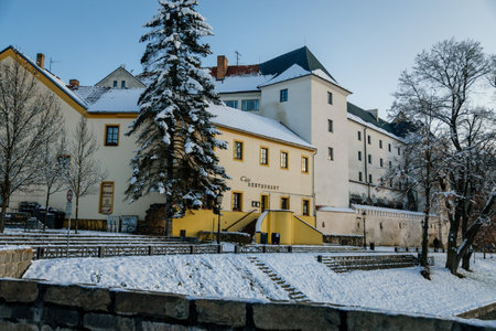 Medieval gothic castle, waterfront buildings over Otava River in winter sunny day, historical citadel, architectural monument of royal town Pisek, Southern Bohemia, Czech Republic, January 09, 2021のeditorial素材
