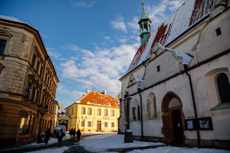 Narrow picturesque street with baroque and renaissance historical buildings in winter sunny day, beautiful cityscape of royal medieval town Pisek, Southern Bohemia, Czech Republic, January 09, 2021のeditorial素材
