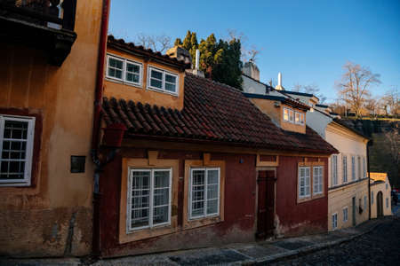 Fascinating narrow picturesque street with baroque and renaissance historical buildings in sunny day, Novy svet, New World in the vicinity of Hradcany, Prague, Czech Republic, December 31, 2020のeditorial素材