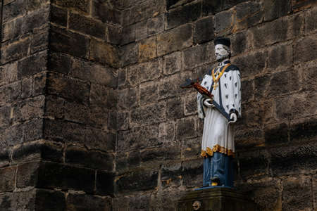 Statue of St. Jan Nepomucky or St. John of Nepomuk near church of the Nativity of Virgin Mary, medieval town with historical buildings, Bohemian Paradise, Turnov, Czech Republic, January 01, 2021のeditorial素材