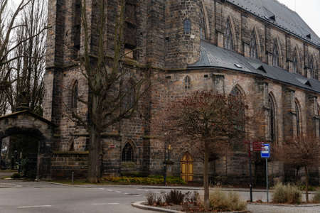 Gothic stone church of the Nativity of the Virgin Mary in winter day, cityscape of medieval town with historical buildings, Bohemian Paradise, Turnov, Czech Republic, January 01, 2021のeditorial素材