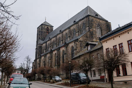 Gothic stone church of the Nativity of the Virgin Mary in winter day, cityscape of medieval town with historical buildings, Bohemian Paradise, Turnov, Czech Republic, January 01, 2021のeditorial素材