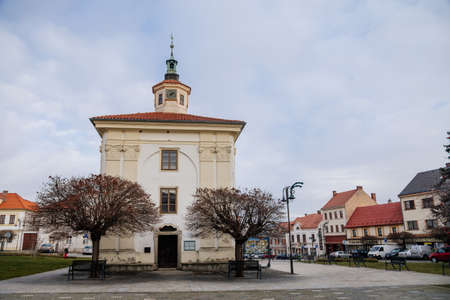 Narrow medieval square with baroque and renaissance historical buildings, Chapel of the Holy Family in sunny winter day, Benatky nad Jizerou, Central Bohemian, Czech Republic, January 01, 2021のeditorial素材