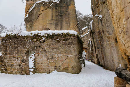 Scenic view of ancient ruins of old gothic medieval castle Helfenburk u Usteka with stone tower under snow in winter day, battlement ring walls, North Bohemia, Czech Republic, January 16, 2021のeditorial素材