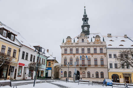 City hall with clock tower on TG Masaryk Square, baroque, renaissance and Art Nouveau historical buildings under snow in winter day, Ceska Lipa, North Bohemia, Czech Republic, January 16, 2021のeditorial素材
