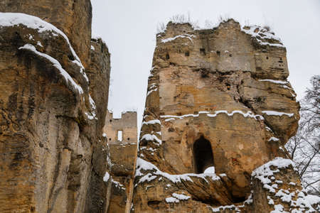 Scenic view of ancient ruins of old gothic medieval castle Helfenburk u Usteka with stone tower under snow in winter day, battlement ring walls, North Bohemia, Czech Republic, January 16, 2021のeditorial素材