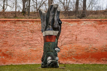 Baroque benedictine monastery Brevnov, Upper orchard with massive brick enclosure walls, wooden sculpture, Garden and park, abbey under snow in winter day, Prague, Czech Republic, January 24, 2021のeditorial素材