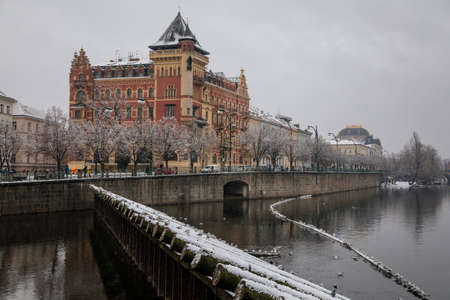 Bellevue house in the style of the Dutch renaissance and Smetana Museum at Smetana embankment, Old town and Vltava river, snow in winter day, Prague, Czech Republic, January 26, 2021のeditorial素材