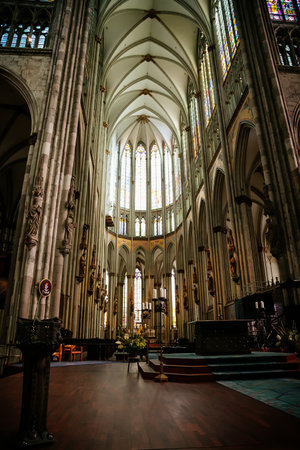 Kolner Dom, Cologne Cathedral Interior, Stained Glass Windows, Roman Catholic gothic church, Details of the sculptures, Nave altar part, ceiling, Rib vault, columns, Cologne, Germany, July 05, 2019のeditorial素材