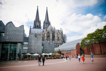 Museum Ludwig with large collection of modern art and Cologne Cathedral, Kolner Dom, Roman Catholic gothic church, two towers with high spiers, summer sunny day, Cologne, Germany, July 05, 2019のeditorial素材