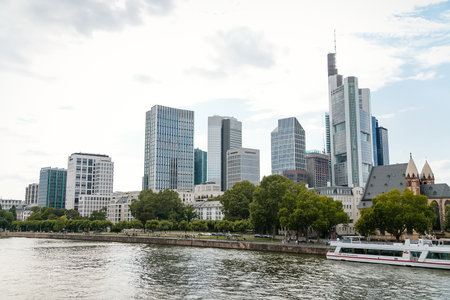 Beautiful view of modern skyscrapers at the financial district alongside river Main, skyline in downtown, cityscape with blue sky, clouds, sunny summer day, Frankfurt am Main, Germany, July 07, 2019のeditorial素材