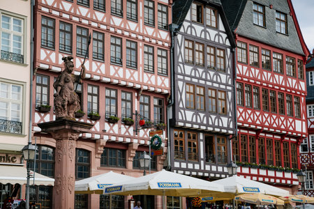 Colorful Half-timbered houses of Romer Square, old town square romerberg, Altstadt, Timber framed historical building, Minervabrunnen or Minerva fountain, Frankfurt am Main, Germany, July 07, 2019のeditorial素材