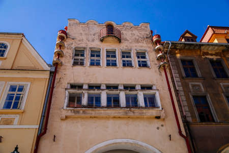 Street with colorful houses in medieval town, renaissance and baroque historical buildings, Modernism and Functionalism, Art nouveau stile, sunny day, Zatec, Bohemia, Czech Republic, April 04, 2021のeditorial素材