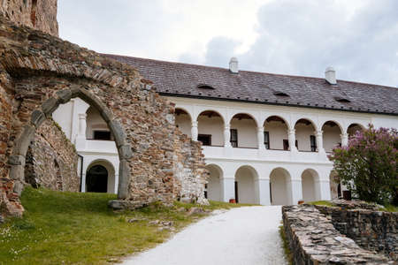 Gothic medieval castle Velhartice, sunny day, white mansion, facade with arches, masonry wall, old stronghold with tower, Velhartice, National Park Sumava, South Bohemia, Czech Republic, May 29, 2021のeditorial素材