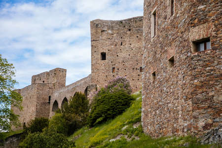 Gothic medieval castle Velhartice in sunny day, tower and stone arch bridge, fortress masonry wall, old stronghold, Velhartice, National Park Sumava, South Bohemia, Czech Republic, May 29, 2021のeditorial素材