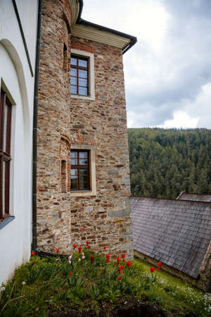 Gothic medieval castle Velhartice in sunny day, tower at the hill near forest, fortress masonry...