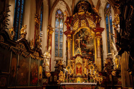 Decorative interior of church St. Henry and St. Kunhuty, gilded ornamented baroque main altar,...