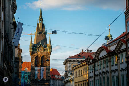 Stone medieval gothic bell Jindrisska Tower at New Town at sunny day, arched windows, blue sky, the highest Henry's belfry, spiers on the bronze roof, Prague, Czech Republic, May 28, 2021のeditorial素材