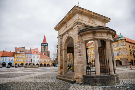 Main town Wallenstein square with colorful renaissance buildings, baroque historic meteorological column, medieval gothic tower Valdice gate or Valdicka brana, Jicin, Czech Republic, May 01, 2021のeditorial素材
