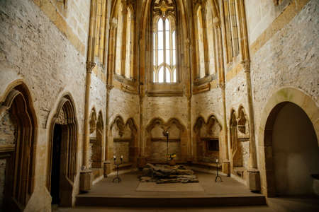 Interior of Chapel of St. Archangel Michael in medieval castle Bezdez, gothic arched windows in church, rib vault, altar part, stone carving, ruin on hill, North Bohemia, Czech Republic, May 08, 2021のeditorial素材