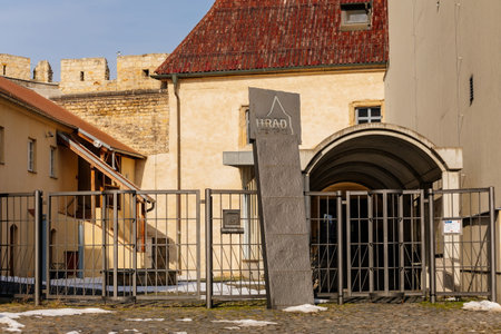 Gothic medieval Litomerice Castle, part of the city fortifications, museum at sunny winter day, red tile roof, wrought iron fence, Litomerice, Czech Republic, February 20, 2021のeditorial素材