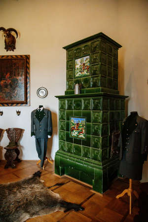 Castle interior, Retro room with wood carved baroque and renaissance furniture, antique green...