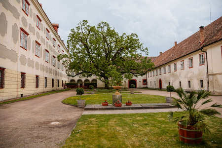 Opocno castle, renaissance chateau, palms and plants in tubs, Italian garden, beige plaster, windows, park with covered paths, sunny summer day, aristocratic residence, Czech Republic, June 12, 2021のeditorial素材