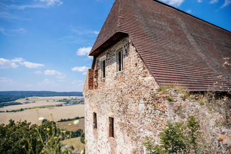 Town Zebrak in Central Bohemia, Czech Republic, 24 July 2021: Medieval royal gothic castle Tocnik, gray stone ruin on hill at sunny summer day, ancient fortress, fairytale stronghold, guard walls.のeditorial素材