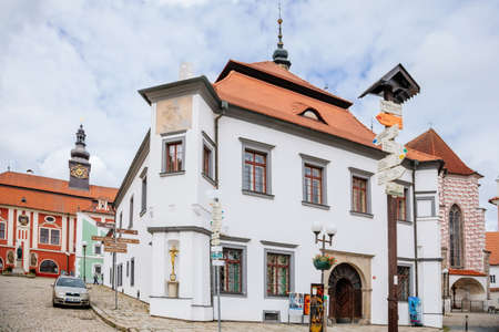 Pelhrimov, Czech Republic, 03 July 2021: renaissance historic building Srejnar House and castle with red facade, mansard roof with prismatic turret and astronomical clock with moving figures.のeditorial素材