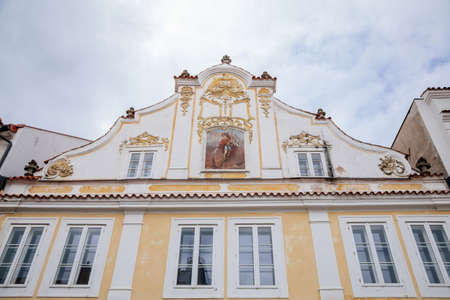 Pelhrimov, Czech Republic, 03 July 2021: narrow picturesque street with colorful medieval renaissance, baroque and gothic historic building, fresco on the house with the image of St. Florian.のeditorial素材