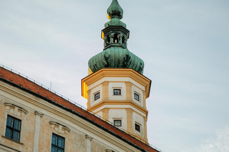 Mikulov, South Moravian Region, Czech Republic, 05 July 2021: Baroque castle or chateau with tower on top of rock surrounded by gardens at sunny summer evening, medieval building in center of town.のeditorial素材