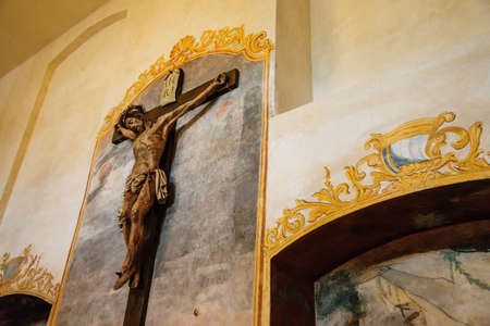 Kuks, East Bohemia, Czech Republic, 10 July 2021: Baroque castle and hospital Kuks, Decorative historic museum interior, crucifix with the image of Jesus Christ.のeditorial素材