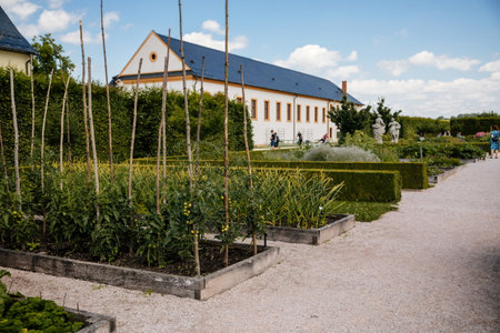 Kuks, East Bohemia, Czech Republic, 10 July 2021: baroque castle and hospital Kuks with herb garden and statues, Beautiful complex with chateau at sunny summer day, flowers, vegetables and fruitsのeditorial素材