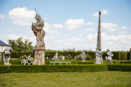 Kuks, East Bohemia, Czech Republic, 10 July 2021: baroque castle and hospital Kuks with herb garden and statues, Beautiful complex with chateau at sunny summer day, flowers, vegetables and fruitsのeditorial素材