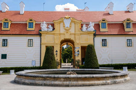 Valtice castle, Southern Moravia, Czech Republic, 04 July 2021: Baroque old historic residences, popular travel destination at sunny summer day, UNESCO world heritage, Sculptures in ornamental garden.のeditorial素材