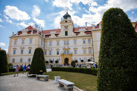 Valtice castle, Southern Moravia, Czech Republic, 04 July 2021: Baroque old historic residences, popular travel destination at sunny summer day, UNESCO world heritage, Sculptures in ornamental garden.のeditorial素材