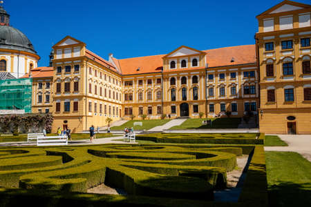 Jaromerice nad Rokytnou, Bohemia, Czech Republic, 06 July 2021: Baroque romantic chateau with park, medieval renaissance castle at summer sunny day, geometrically trimmed green bushes in garden.のeditorial素材