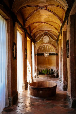 Jaromerice nad Rokytnou, Czech Republic, 06 July 2021: Castle interior of baroque and renaissance castle, brown Sala terrena or Roman baths, painted walls with floral ornaments, antique statues.のeditorial素材