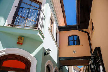 Trebic, Bohemia, Czech Republic, 06 July 2021: Narrow picturesque street with colorful buildings in historic center in medieval city, renaissance and baroque historical buildings at summer sunny day.のeditorial素材