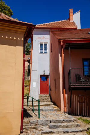 Trebic, Bohemia, Czech Republic, 06 July 2021: Narrow picturesque street with colorful buildings in historic center in medieval city, renaissance and baroque historical buildings at summer sunny day.のeditorial素材