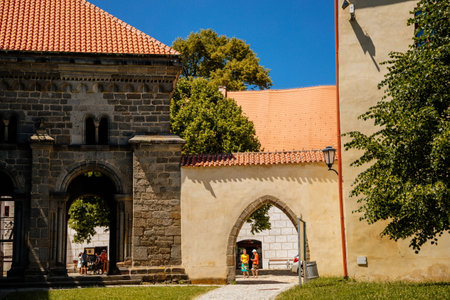 Trebic, Bohemia, Czech Republic, 06 July 2021: medieval castle with museum in historic center, St. Procopius basilica and monastery Romanesque Gothic style, Benedictine herb garden, sunny summer day.のeditorial素材