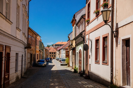 Trebic, Bohemia, Czech Republic, 06 July 2021: Narrow picturesque street with colorful buildings in historic center in medieval city, renaissance and baroque historical buildings at summer sunny day.のeditorial素材