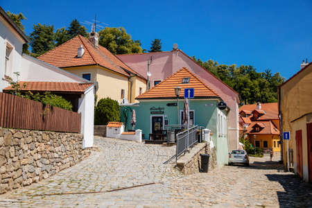 Trebic, Bohemia, Czech Republic, 06 July 2021: Narrow picturesque street with colorful buildings in historic center in medieval city, renaissance and baroque historical buildings at summer sunny day.のeditorial素材