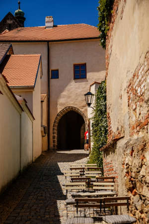 Trebic, Bohemia, Czech Republic, 06 July 2021: Narrow picturesque street with colorful buildings in historic center in medieval city, renaissance and baroque historical buildings at summer sunny day.のeditorial素材