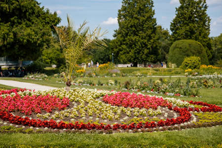 Lednice, Southern Moravia, Czech Republic, 04 July 2021: chateau with beautiful gardens, green parks at sunny summer day, neo-gothic romantic castle, geometric flower bed, Lednice Valtice Landscape.のeditorial素材