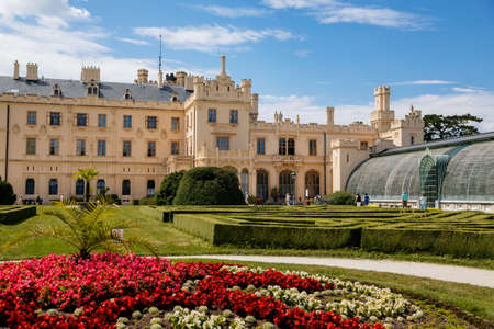 Lednice, Southern Moravia, Czech Republic, 04 July 2021: chateau with beautiful gardens, flower parks on sunny summer day, neo-gothic romantic castle, UNESCO World Heritage, Lednice Valtice Landscape.のeditorial素材