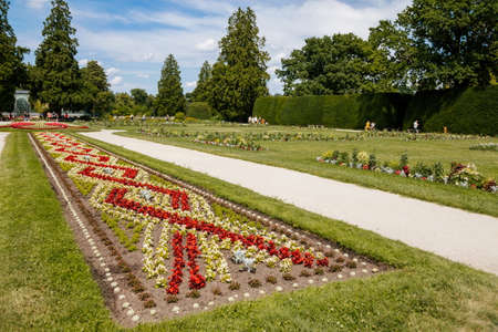 Lednice, Southern Moravia, Czech Republic, 04 July 2021: chateau with beautiful gardens, green parks at sunny summer day, neo-gothic romantic castle, geometric flower bed, Lednice Valtice Landscape.のeditorial素材