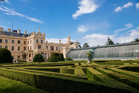 Lednice, Southern Moravia, Czech Republic, 04 July 2021: chateau with beautiful gardens, green parks at sunny summer day, neo-gothic romantic castle, geometric flower bed, Lednice Valtice Landscape.のeditorial素材