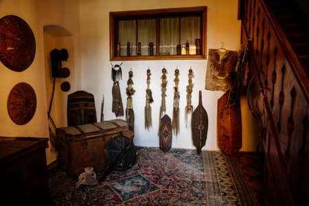 Lednice, Southern Moravia, Czech Republic, 04 July 2021: Castle interior, african room with exotic trophies, shields hanging on the walls, antique chest on persian carpet, beautiful UNESCO chateau.のeditorial素材