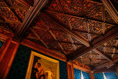Lednice, Southern Moravia, Czech Republic, 04 July 2021: Castle interior with neo-gothic carved furniture, Details of a beautiful wooden ceiling with floral ornaments, UNESCO World Heritage chateau.のeditorial素材